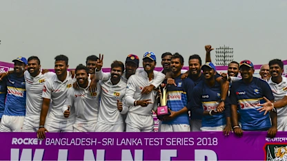 The Sri Lankans pose with their spoils after winning the two-Test series in Bangladesh.