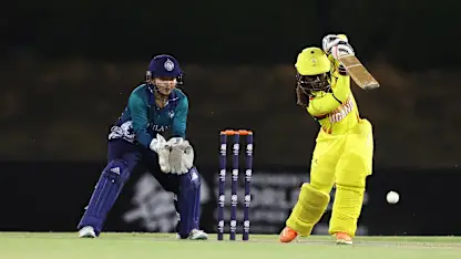 Kevin Awino of Uganda plays a shot as Nannapat Koncharoenkai of Thailand keeps during the ICC Women's T20 World Cup Qualifier 2024 match between Uganda and Thailand at Tolerance Oval on April 29, 2024 in Abu Dhabi, United Arab Emirates.