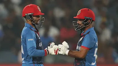 Logo of Azmatullah Omarzai and Hashmatullah Shahidi of Afghanistan interact during the ICC Men's Cricket World Cup India 2023 between Afghanistan and Sri Lanka