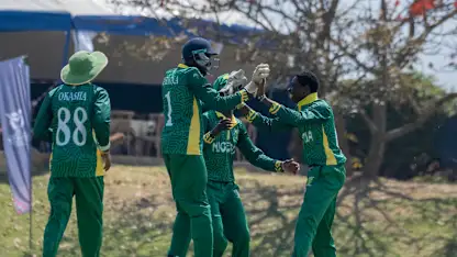 120826 Nigeria Vs Rwanda-Nigeria players join Kenneth Boniface(far right) after picking a wicket