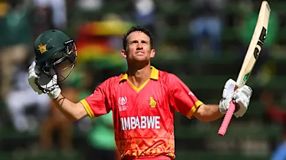 Logo of Sean Williams of Zimbabwe celebrates after scoring a century during the ICC Men's Cricket World Cup Qualifier Zimbabwe 2023 match between Zimbabwe and USA