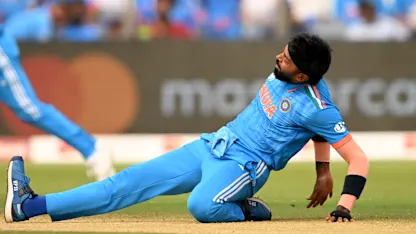 Logo of Hardik Pandya of India reacts in their follow through after bowling during the ICC Men's Cricket World Cup India 2023 between India and Bangladesh (2)
