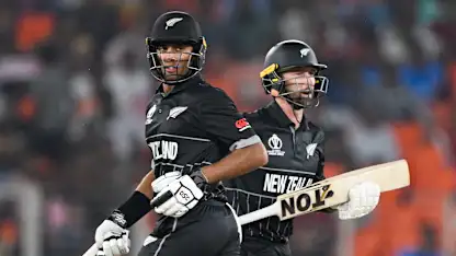 Logo of New Zealand's Rachin Ravindra (L) and Devon Conway run between the wickets during the 2023 ICC men's cricket World Cup one-day international
