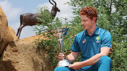 Hugh Weibgen with the U19 Men's CWC Trophy