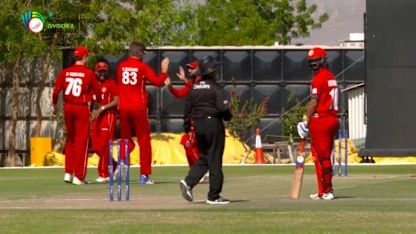 WCL Div 3 – Denmark bowler Nicolaj Laegsgaard sends back an Oman batsman