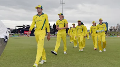 Logo of Jason Sangha and Australia's players leave the field