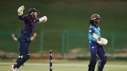 Sarah Bryce of Scotland celebrates after taking a catch for the wicket of Vishmi Gunaratne of Sri Lanka during the ICC Women's T20 World Cup Qualifier 2024 Final match between Scotland and Sri Lanka at Zayed Cricket Stadium on May 07, 2024 in Abu Dhabi, United Arab Emirates.