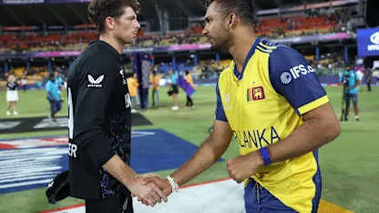 Opposition skippers Mitch Santner and Dasun Shanaka shake hands