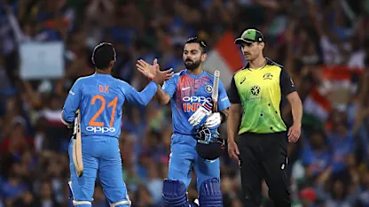 Logo of Kohli and Karthik celebrate victory