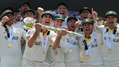Logo of Pat Cummins of Australia lifts the ICC World Test Championship Mace on day five of the ICC World Test Championship Final between Australia and India