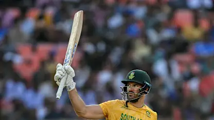 Aiden Markram raises his bat for his half-century