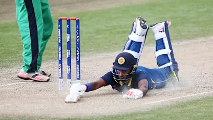 Logo of Dhananjaya Lakshan of Sri Lanka dives to make his ground
