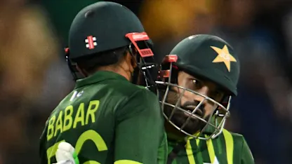 Pakistan's Captain Babar Azam celebrates after scoring a half-century with Pakistan's Muhammad Rizwan 1920x1080