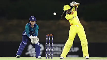 Janet Mbabazi of Uganda plays a shot as Nannapat Koncharoenkai of Thailand keeps during the ICC Women's T20 World Cup Qualifier 2024 match between Uganda and Thailand at Tolerance Oval on April 29, 2024 in Abu Dhabi, United Arab Emirates.