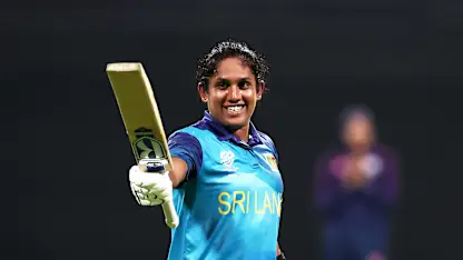 Chamari Athapaththu of Sri Lanka celebrates her century during the ICC Women's T20 World Cup Qualifier 2024 Final match between Scotland and Sri Lanka at Zayed Cricket Stadium on May 07, 2024 in Abu Dhabi, United Arab Emirates.