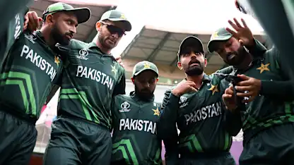 Logo of Babar Azam of Pakistan speaks to their side in the huddle ahead of the ICC Men's Cricket World Cup India 2023 between New Zealand and Pakistan