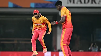 Blessing Muzarabani and Sikandar Raza celebrate a wicket