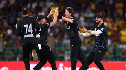 Matt Henry is mobbed by teammates after the dismissal of Pathum Nissanka