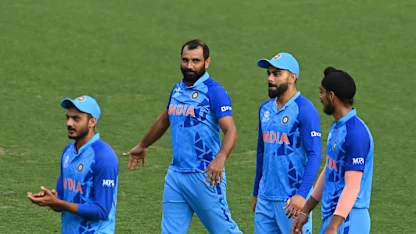 Virat Kohli with a diving direct hit to dismiss Tim David