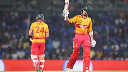 Brian Bennett raises his bat for a half-century for Zimbabwe in their T20 World Cup meeting with India