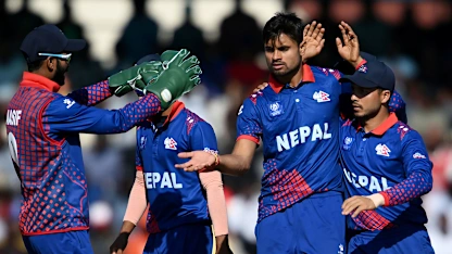 Logo of Dipendra Singh Airee of Nepal (L) and Sompal Kami of Nepal run between the wickets during the Asia Cup Group A match between India and Nepal