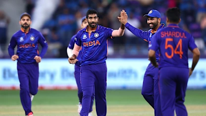 Logo of Bumrah with the first wicket for India