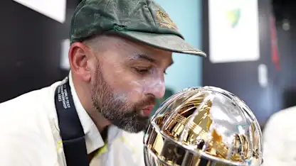 Logo of Nathan Lyon of Australia poses for a photo with the ICC World Test Championship Mace in the changing room on day five of the ICC World Test Championship Final between Australia and India