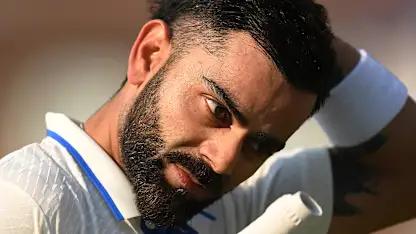 Logo of Virat Kohli of India leaves teh field after day four of the ICC World Test Championship Final between Australia and India