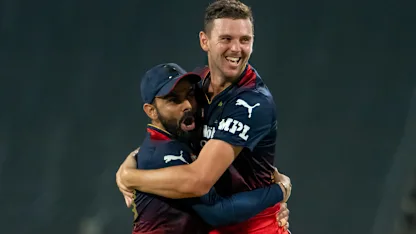 Logo of Hazlewood Kohli RCB embrace 1920x1080