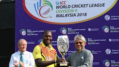 Logo of Uganda captain receives the WCL Div 4 champions trophy
