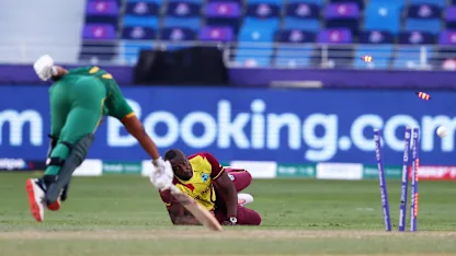 Logo of A bullet of a throw from Russell gets the wicket of Bavuma