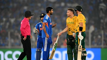 Washington Sundar of India speaks to David Miller and Tristan Stubbs of South Africa during the ICC Men's T20 World Cup 2026 Super 8 match
