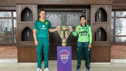 South Africa's Laura Wolvaardt and Pakistan's Fatima Sana posing with the ODI series trophy in Lahore