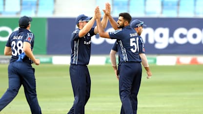 Scotland celebrate wicket of Chirag Suri