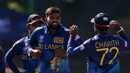 Wanindu Hasaranga of Sri Lanka celebrates with teammates after taking the wicket of Shoaib Khan of Oman during the ICC Men Cricket World Cup Qualifier Zimbabwe