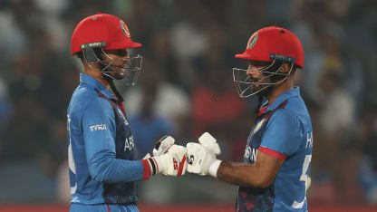 Azmatullah Omarzai and Hashmatullah Shahidi of Afghanistan interact during the ICC Men's Cricket World Cup India 2023 between Afghanistan and Sri Lanka