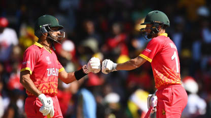 Sikandar Raza and Sean Williams of Zimbabwe fist bump between overs during the ICC Men's Cricket World Cup Qualifier Zimbabwe 2023 Super 6 match between Zimbabwe and Sri Lanka
