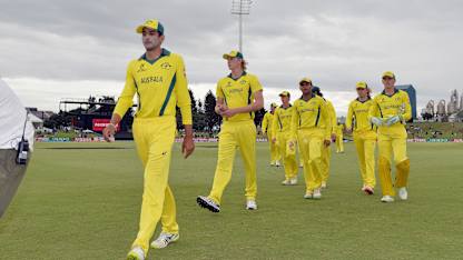 Jason Sangha and Australia's players leave the field