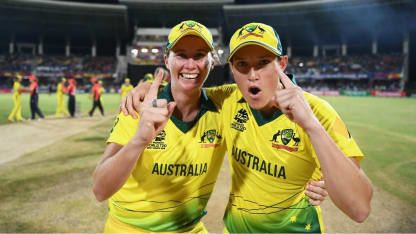 Australia's players react in the immediate aftermath to their WT20 title win