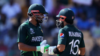 Babar Azam and Mohammad Rizwan of Pakistan interact during the ICC Men's Cricket World Cup India 2023 between Pakistan and South Africa