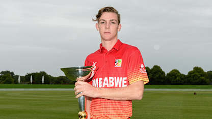Zimbabwe U19 captain Liam Roche poses with the ICC Under 19 Cricket World Cup trophy.