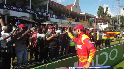 Sikandar Raza giving a stump to his friend Umar Shah