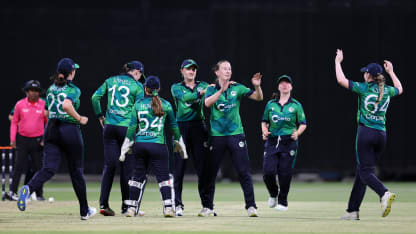 Orla Prendergast of Ireland celebrates with teammates after taking the wicket of Sterre Kalis of the Netherlands.