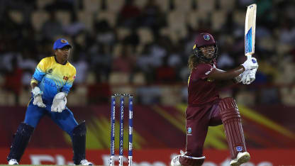 Hayley Matthews of Windies hits the ball towards the boundary, as Dilani Manodara of Sri Lanka looks on during the ICC Women's World T20 2018 match between Windies and Sri Lanka at Darren Sammy Cricket Ground on November 16, 2018