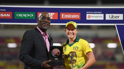 Alyssa Healy of Australia is presented with the Player of the Tournament award by Sir Viv Richards.
