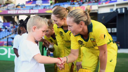 Meg Lanning of Australia shakes hands with a young mascot during the ICC Women's World T20 2018 Semi-Final match between Windies and Australia at Sir Viv Richards Cricket Ground on November 22, 2018 in Antigua, Antigua and Barbuda.