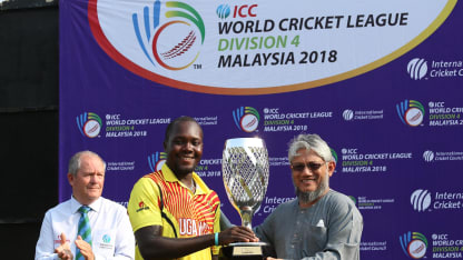 Uganda captain receives the WCL Div 4 champions trophy