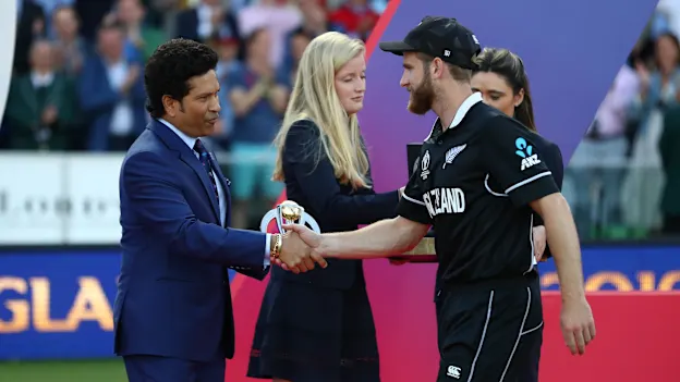 Kane Williamson the New Zealand captain receives the player of the tournament award from Sachin Tendulkar at the presentation ceremony.