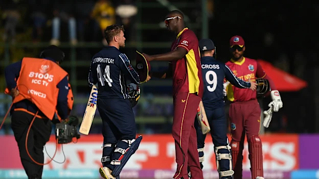 Richie Berrington of Scotland and Jason Holder of West Indies shake hands following the ICC Men's Cricket World Cup Qualifier Zimbabwe 2023 Super 6 match between Scotland and West Indies at Harare Sports Club on July 01, 2023 in Harare, Zimbabwe.