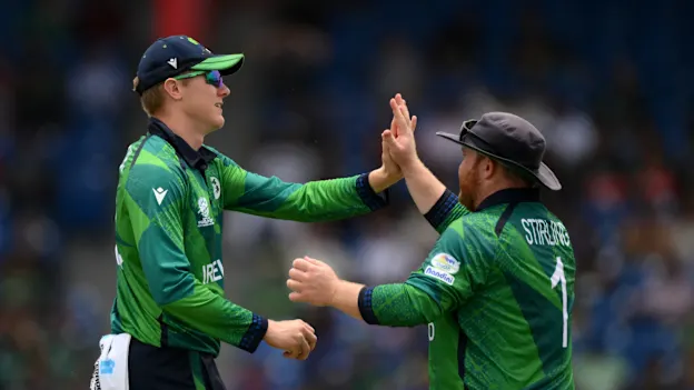 Harry Tector of Ireland celebrates with team mate Paul Stirling after catching Imad Wasim of Pakistan 